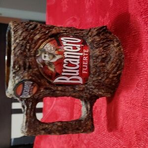 Bicanero - This mug looks to be crafted from the bark of a tree, inside glass.